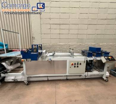 Line for manufacturing disposable non-woven shoe soles