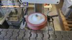 Automatic self-adhesive labeling machine for cylindrical bottles