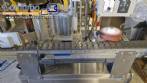 Automatic self-adhesive labeling machine for cylindrical bottles