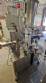 Automatic self-adhesive labeling machine for cylindrical bottles