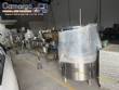 Milainox automatic rotary filling, dosing, and sealing machine for cups, pots, and jars.