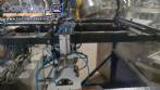 Pick and place product feeder for flowpack transfer cartoning machine