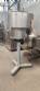 Complete filling line with Tecman Nelpas Tecnoenvase Tudela bottle filling, labeling, capping, and positioning machines for cosmetic liquids.