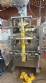 Vertical automatic packaging machine for ARV powders