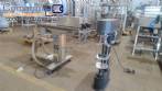 Filling machine with 2 nozzles for liquids and pilfer cap screwer