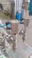 Filling machine with 2 nozzles for liquids and pilfer cap screwer