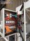 Automatic baling machine with shrink tunnel for bottles and jars in bales.