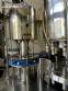 Packaging line with IMSB bung capper, Maqmundi labeler and accumulator table