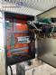 Automatic labeling machine for flat cylindrical bottles and jars Maqmundi