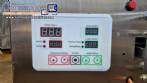 Dosing and packaging machine for granular and powdered products