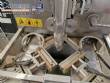 Vertical wrapping machine for triangular format
