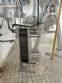 Tilting mixer tap with conical bottom, made of stainless steel.