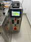 Automatic volumetric dosing packaging machine for powder products.