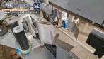 Automatic double-head labeling machine for cylindrical and flat bottles, Tudela, 3,000 labels per hour.