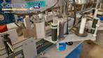 Automatic double-head labeling machine for cylindrical and flat bottles, Tudela, 3,000 labels per hour.