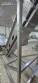 Inova Industrial inclined stainless steel conveyor belt with cleats.