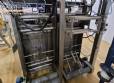 Masipack 16 Twin multi-head vertical packaging machine with conveyor belt and platform.