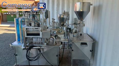 Delgo rotary bottle and jar filling machine for pasty, sweet, and dairy products.