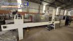 Labeling machine with steam sleeve tunnel and bottle baler