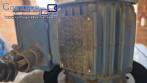 Labeling machine with steam sleeve tunnel and bottle baler
