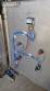 Labeling machine with steam sleeve tunnel and bottle baler