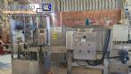 Labeling machine with steam sleeve tunnel and bottle baler