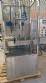 Labeling machine with steam sleeve tunnel and bottle baler