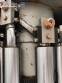 Zegla rotary filling machine with rinser and three-block capping system.