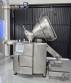 Handtmann vacuum stuffer with twister and tilting elevator, up to 6,000 kg per hour.