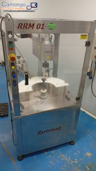 Rotmaq screw capping machine with cap positioning elevator Rotmaq screw capping machine with cap positioning elevator